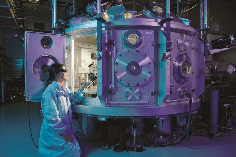 One of our scientists working with the newest machine in science